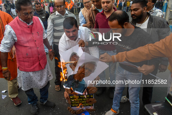 Pro-Hindu activists stage a protest in Kolkata, India, on December 10, 2024, against the attack on minorities in Bangladesh. They burn a pic...