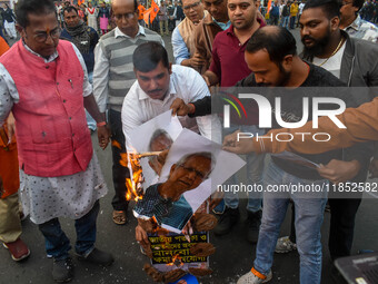 Pro-Hindu activists stage a protest in Kolkata, India, on December 10, 2024, against the attack on minorities in Bangladesh. They burn a pic...