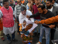 Pro-Hindu activists stage a protest in Kolkata, India, on December 10, 2024, against the attack on minorities in Bangladesh. They burn a pic...