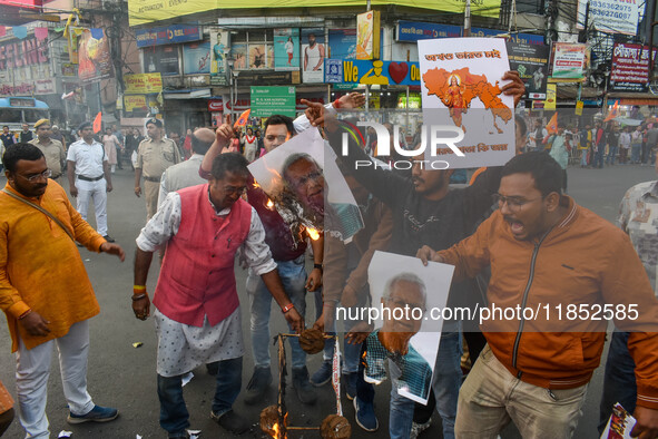 Pro-Hindu activists stage a protest in Kolkata, India, on December 10, 2024, against the attack on minorities in Bangladesh. They burn a pic...