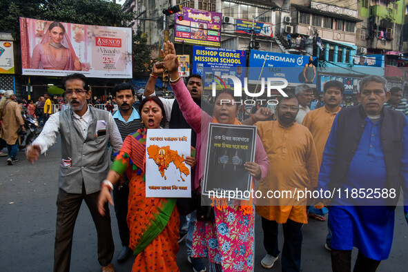 Pro-Hindu activists stage a protest in Kolkata, India, on December 10, 2024, against the attack on minorities in Bangladesh. They burn a pic...