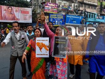 Pro-Hindu activists stage a protest in Kolkata, India, on December 10, 2024, against the attack on minorities in Bangladesh. They burn a pic...