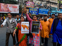 Pro-Hindu activists stage a protest in Kolkata, India, on December 10, 2024, against the attack on minorities in Bangladesh. They burn a pic...