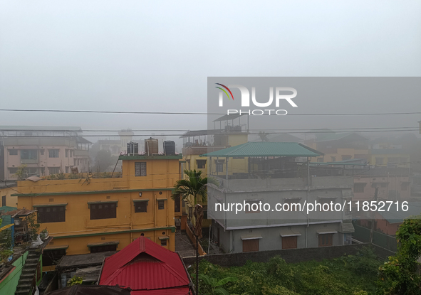 Residential buildings are seen during a cold and foggy day in Siliguri, India, on December 10, 2024. 