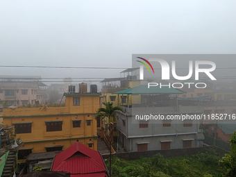 Residential buildings are seen during a cold and foggy day in Siliguri, India, on December 10, 2024. (