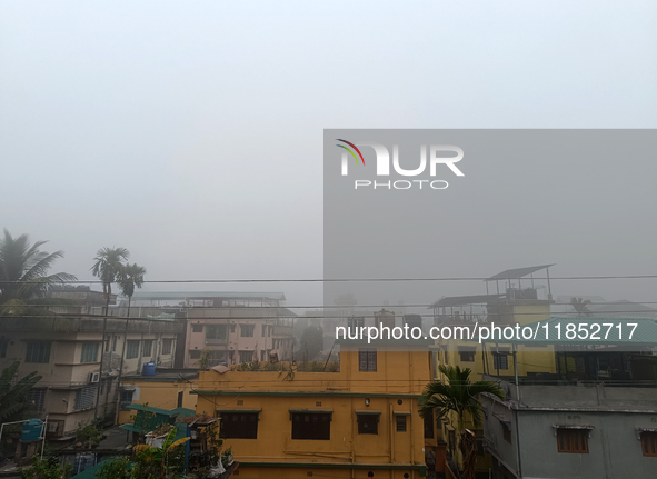 Residential buildings are seen during a cold and foggy day in Siliguri, India, on December 10, 2024. 