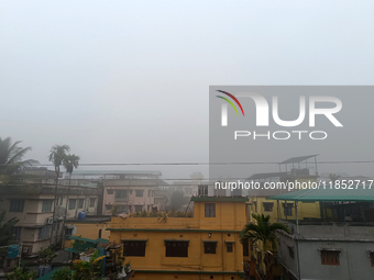 Residential buildings are seen during a cold and foggy day in Siliguri, India, on December 10, 2024. (