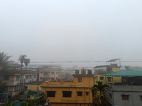 Residential buildings are seen during a cold and foggy day in Siliguri, India, on December 10, 2024. (