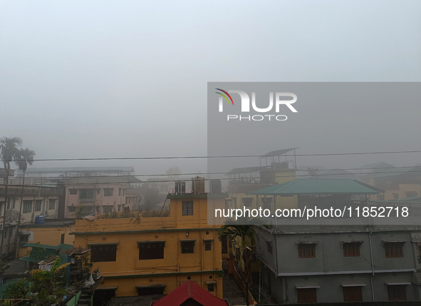 Residential buildings are seen during a cold and foggy day in Siliguri, India, on December 10, 2024. 