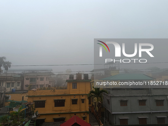 Residential buildings are seen during a cold and foggy day in Siliguri, India, on December 10, 2024. (