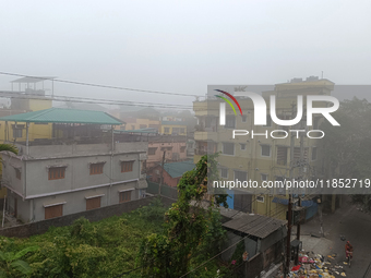 Residential buildings are seen during a cold and foggy day in Siliguri, India, on December 10, 2024. (