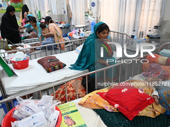 Children receive medical treatment for pneumonia at Dhaka Children's Hospital during the winter season in Dhaka, Bangladesh, on December 10,...