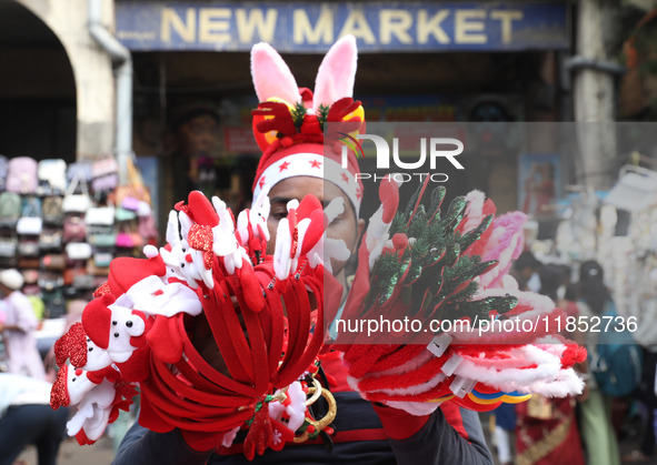 A vendor sells Christmas goodies on a street in Kolkata, India, on December 10, 2024. 