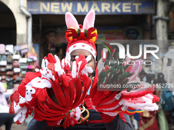 A vendor sells Christmas goodies on a street in Kolkata, India, on December 10, 2024. (