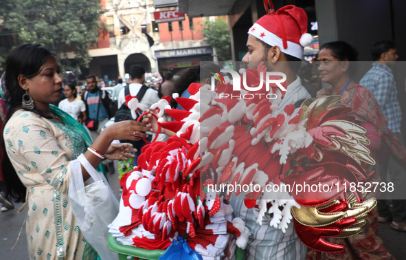 A vendor sells Christmas goodies on a street in Kolkata, India, on December 10, 2024. 