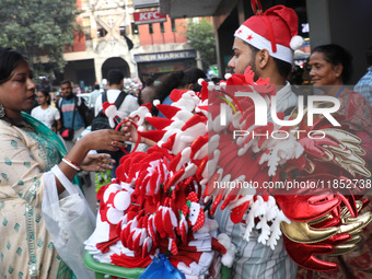 A vendor sells Christmas goodies on a street in Kolkata, India, on December 10, 2024. (