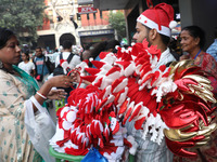 A vendor sells Christmas goodies on a street in Kolkata, India, on December 10, 2024. (