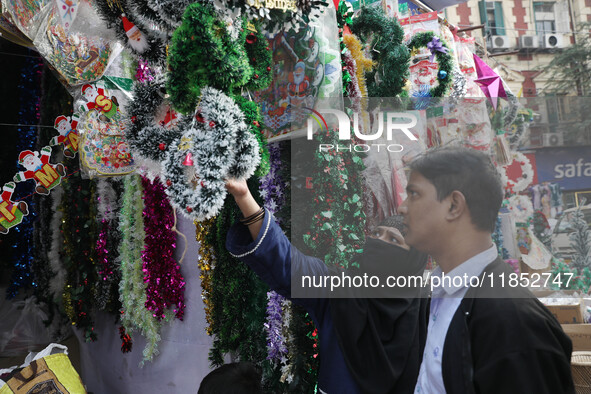 People buy decorative items from a Christmas Market ahead of Christmas in Kolkata, India, on December 10, 2024. 