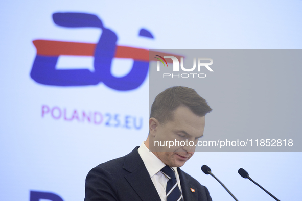 Polish Minister for European Affairs Adam Szlapka looks down during the presentation of the program for the 2025 Poland's Presidency of the...