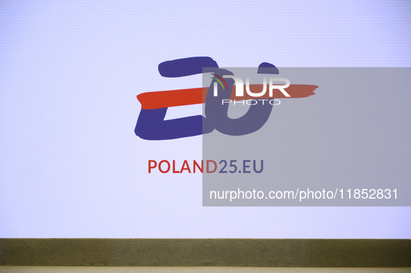 The Polish EU presidency logo appears on a screen during Minister for European Affairs Adam Szlapka's presentation of the program for Poland...