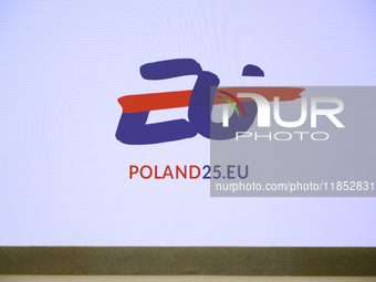 The Polish EU presidency logo appears on a screen during Minister for European Affairs Adam Szlapka's presentation of the program for Poland...