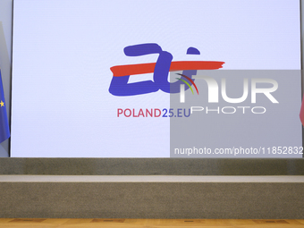 The Polish EU presidency logo appears on a screen during Minister for European Affairs Adam Szlapka's presentation of the program for Poland...