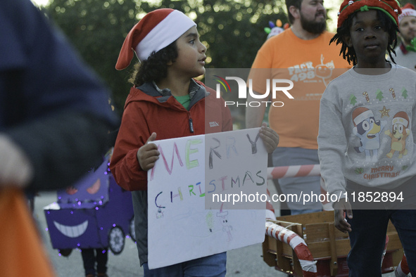 At the 7th Annual Twilight Parade in Hunters Creek, Florida, on Saturday, October 7, children and families take to the streets to watch the...