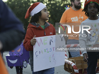 At the 7th Annual Twilight Parade in Hunters Creek, Florida, on Saturday, October 7, children and families take to the streets to watch the...