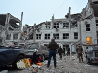 A search and rescue operation takes place after a Russian missile strike in Zaporizhzhia, Ukraine, on December 10, 2024. Three people are de...