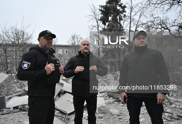 Police officers are near the scene of a Russian missile strike in Zaporizhzhia, Ukraine, on December 10, 2024. Three people are dead and at...