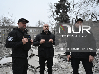 Police officers are near the scene of a Russian missile strike in Zaporizhzhia, Ukraine, on December 10, 2024. Three people are dead and at...