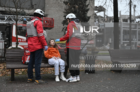 In Zaporizhzhia, Ukraine, on December 10, 2024, Rapid Response Team members talk to a woman injured by a Russian missile strike. Three peopl...