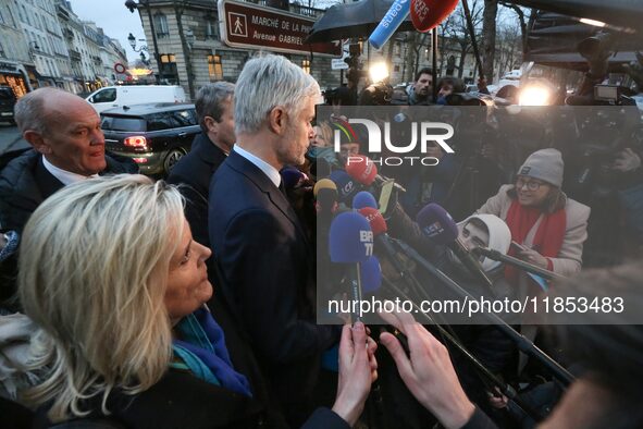 President of the Droite Republicaine parliamentary group, Laurent Wauquiez, speaks to journalists after his meeting with the French presiden...