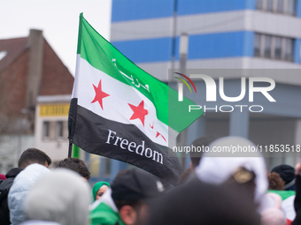 More than a hundred people celebrate post Al Assad in front of Duisburg Central Station in Duisburg, Germany, on December 10, 2024. (