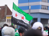 More than a hundred people celebrate post Al Assad in front of Duisburg Central Station in Duisburg, Germany, on December 10, 2024. (