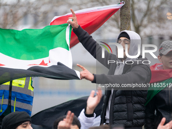 More than a hundred people celebrate post Al Assad in front of Duisburg Central Station in Duisburg, Germany, on December 10, 2024. (