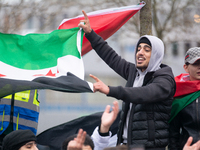 More than a hundred people celebrate post Al Assad in front of Duisburg Central Station in Duisburg, Germany, on December 10, 2024. (