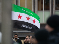 More than a hundred people celebrate post Al Assad in front of Duisburg Central Station in Duisburg, Germany, on December 10, 2024. (