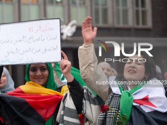 More than a hundred people celebrate post Al Assad in front of Duisburg Central Station in Duisburg, Germany, on December 10, 2024. (