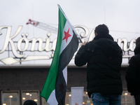 More than a hundred people celebrate post Al Assad in front of Duisburg Central Station in Duisburg, Germany, on December 10, 2024. (