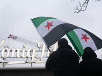 More than a hundred people celebrate post Al Assad in front of Duisburg Central Station in Duisburg, Germany, on December 10, 2024. (