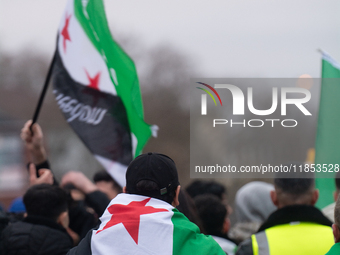 More than a hundred people celebrate post Al Assad in front of Duisburg Central Station in Duisburg, Germany, on December 10, 2024. (