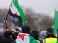 More than a hundred people celebrate post Al Assad in front of Duisburg Central Station in Duisburg, Germany, on December 10, 2024. (