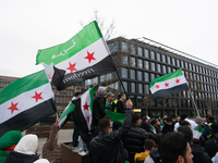 More than a hundred people celebrate post Al Assad in front of Duisburg Central Station in Duisburg, Germany, on December 10, 2024. (