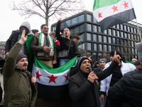 More than a hundred people celebrate post Al Assad in front of Duisburg Central Station in Duisburg, Germany, on December 10, 2024. (