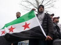 More than a hundred people celebrate post Al Assad in front of Duisburg Central Station in Duisburg, Germany, on December 10, 2024. (