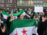 More than a hundred people celebrate post Al Assad in front of Duisburg Central Station in Duisburg, Germany, on December 10, 2024. (