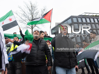 More than a hundred people celebrate post Al Assad in front of Duisburg Central Station in Duisburg, Germany, on December 10, 2024. (