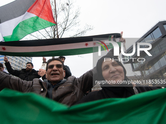 More than a hundred people celebrate post Al Assad in front of Duisburg Central Station in Duisburg, Germany, on December 10, 2024. (