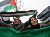 More than a hundred people celebrate post Al Assad in front of Duisburg Central Station in Duisburg, Germany, on December 10, 2024. (